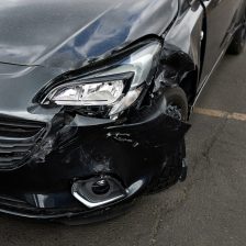 Detail Of Damage To Headlight Of Vehicle In Car Park
